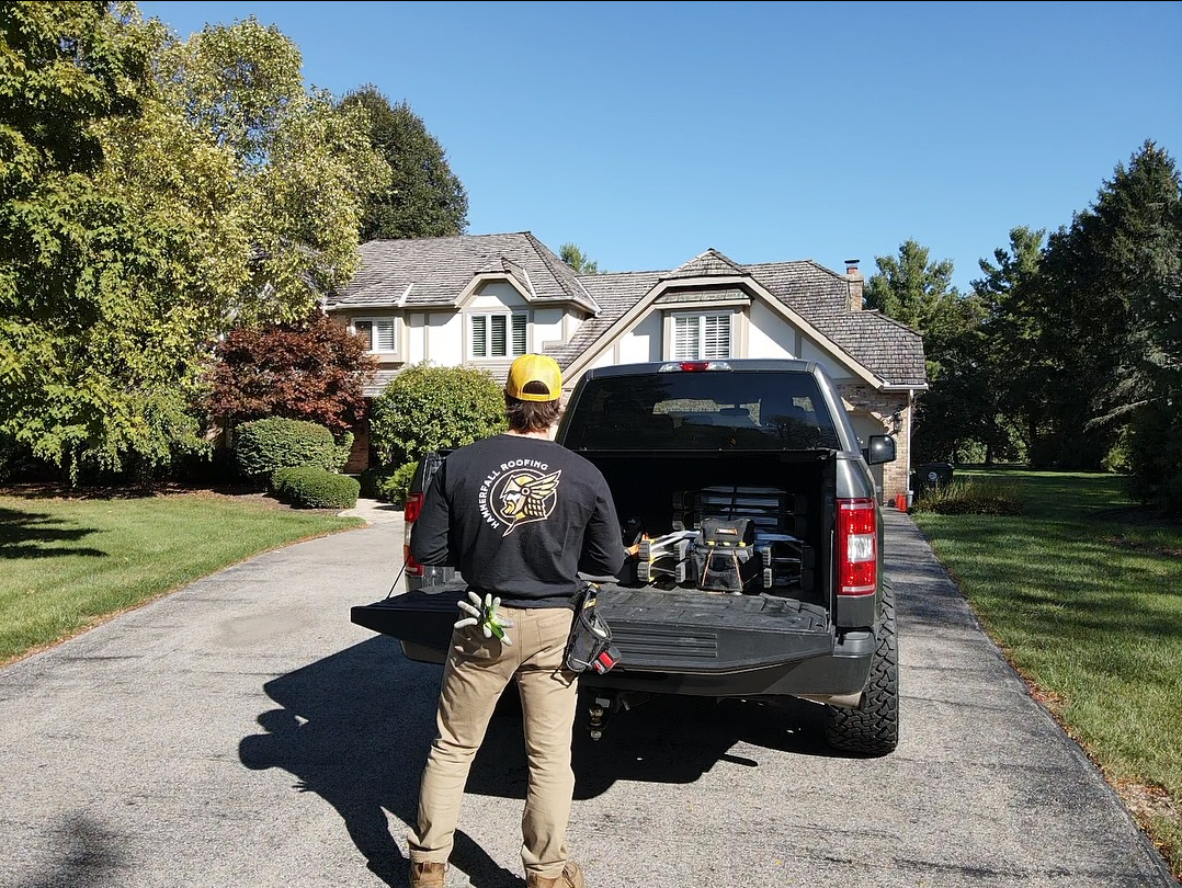 Hammerfall Roofing owner arriving at a local home with his work truck